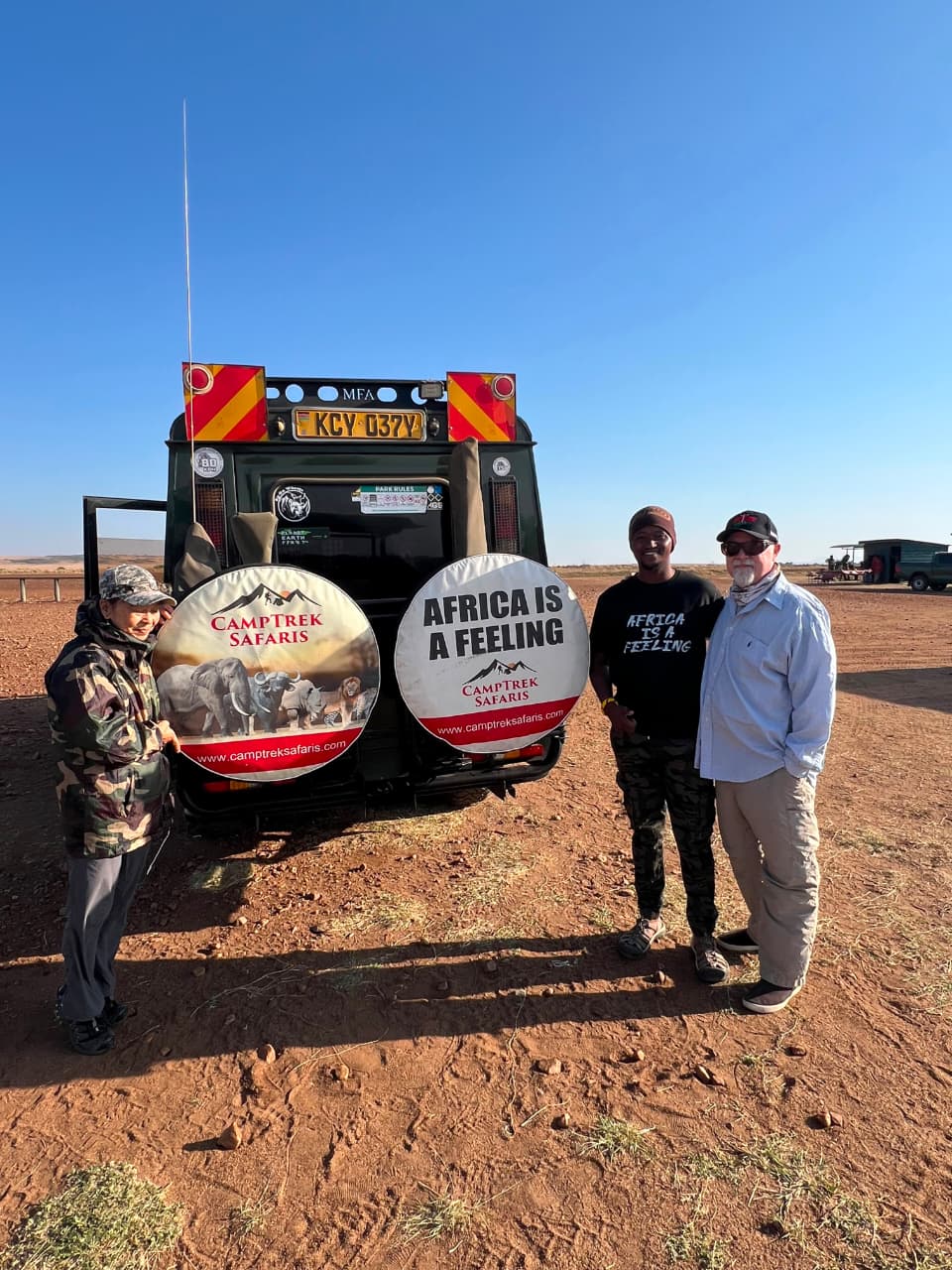 Luxury Safari Planning: What Client Feedback Teaches Us About Better Safari Experiences 20 The CampTrek Safaris team beside a safari vehicle