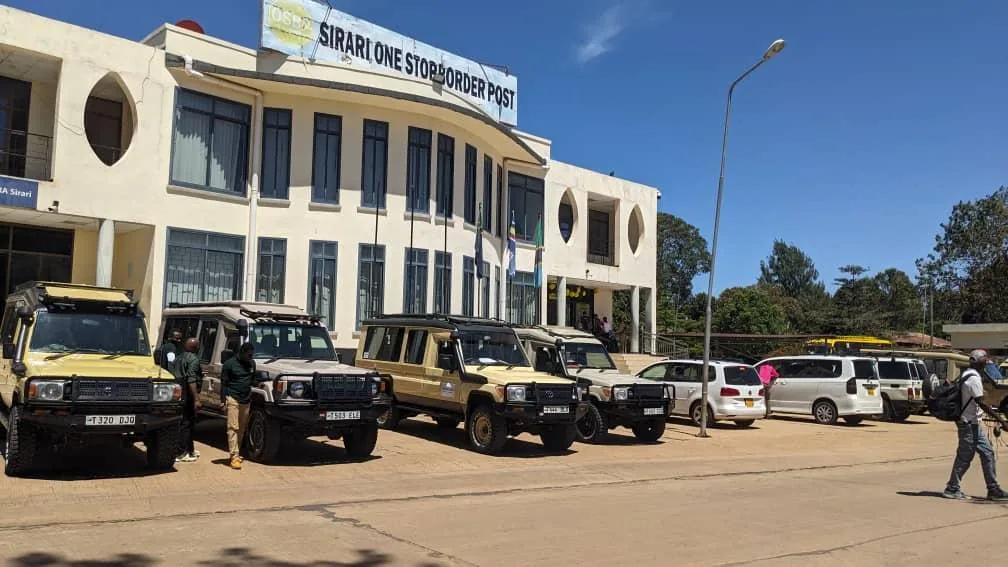 Safari Land Cruisers parked at the Sirari One Stop Border Post, the Tanzanian side of the Isebania crossing from Kenya