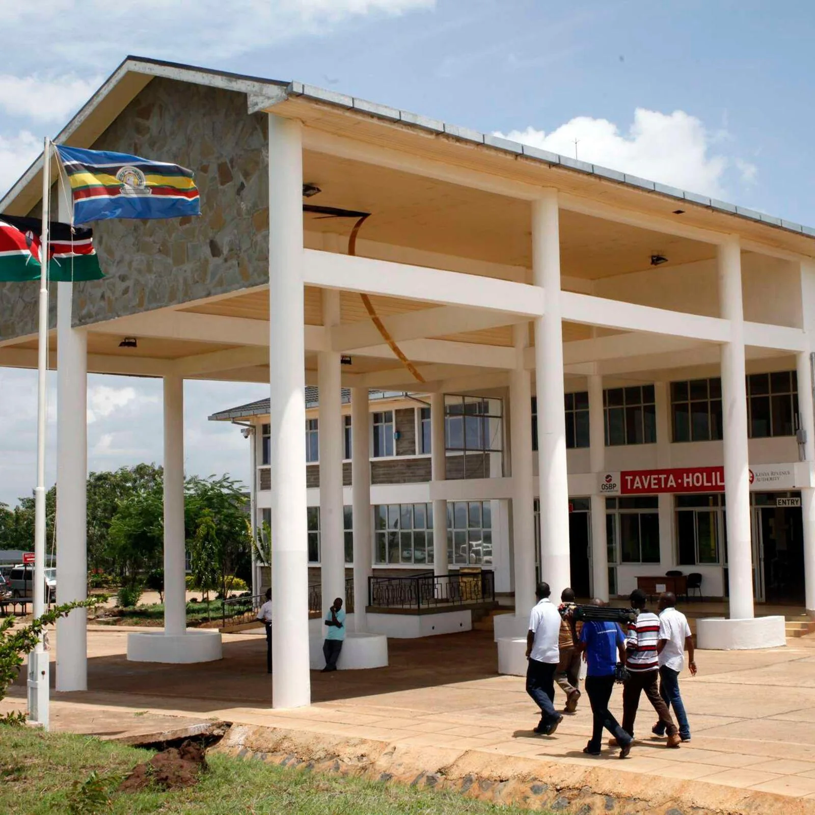 Taveta–Holili One Stop Border Post building with the Kenyan and East African Community flags